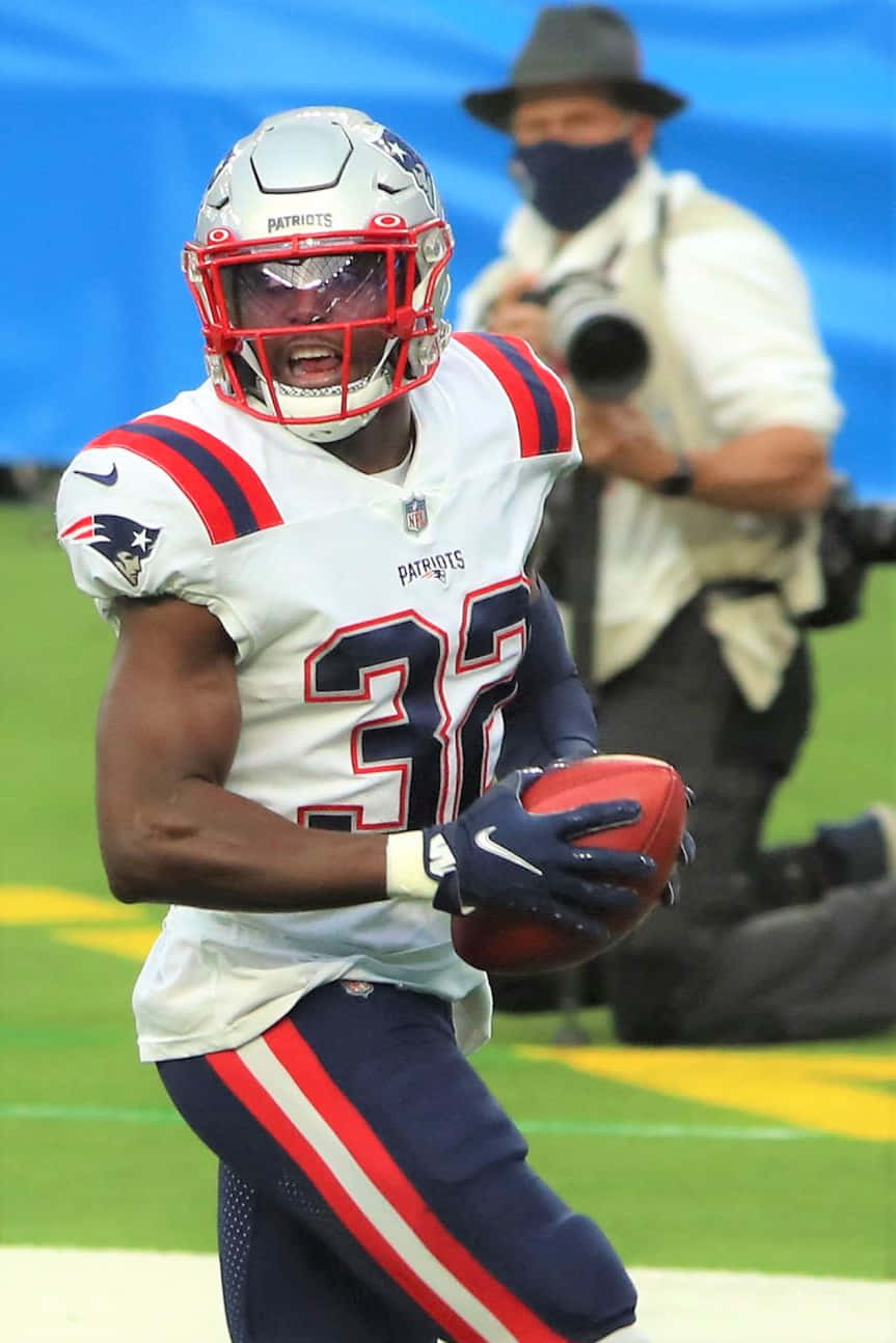 Devin Mccourty In Action On The Field Wallpaper