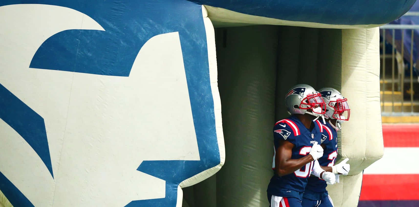 Devin Mccourty In Action On The Football Field Wallpaper