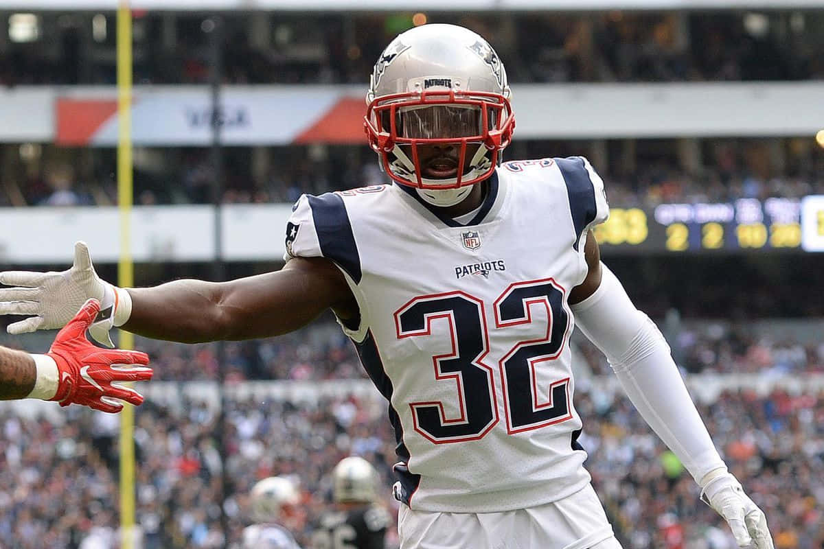 Devin Mccourty Of The New England Patriots In Action Wallpaper