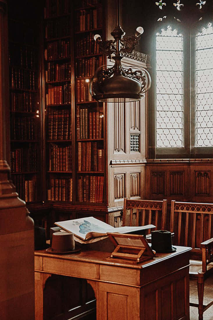 Discover The Magic Of The Hogwarts Library Wallpaper