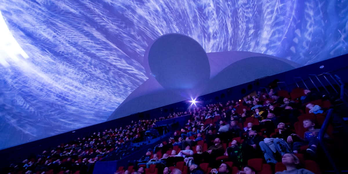 Discover The Wonders Of The Cosmos At The Planetarium Wallpaper