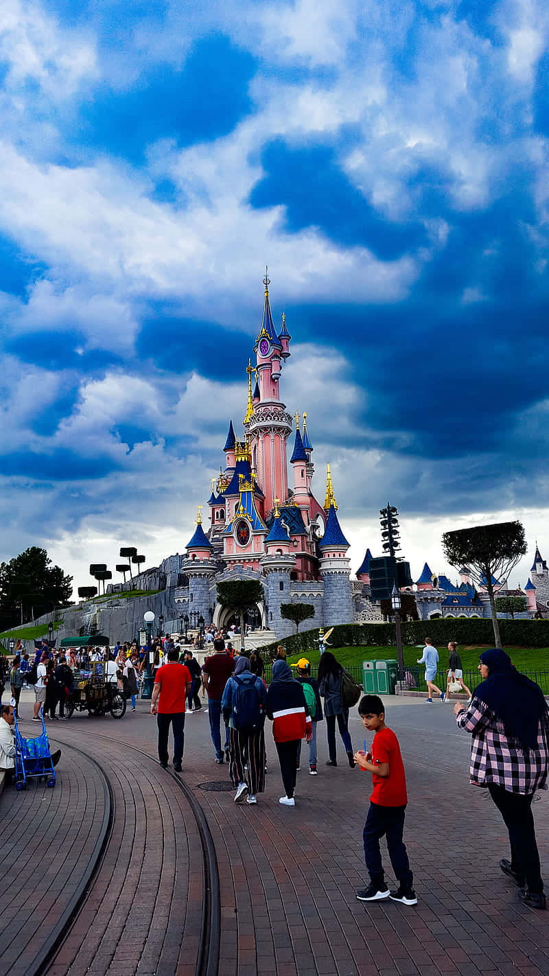 Disneyland Paris With Several Tourists Wallpaper