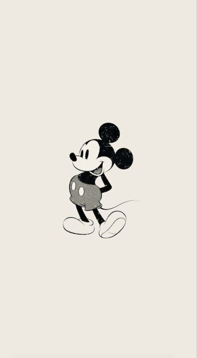 Disney’s Iconic Mickey Mouse Standing Out On A Sleek Black Background. Wallpaper