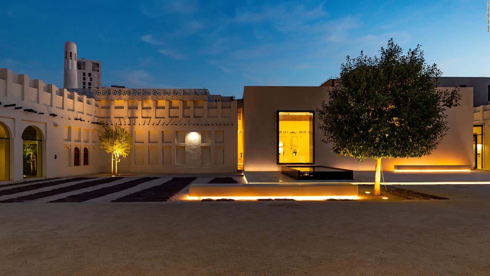 Distinctive Architecture Of The Museum Of Islamic Art Against A Vivid Sunset Wallpaper