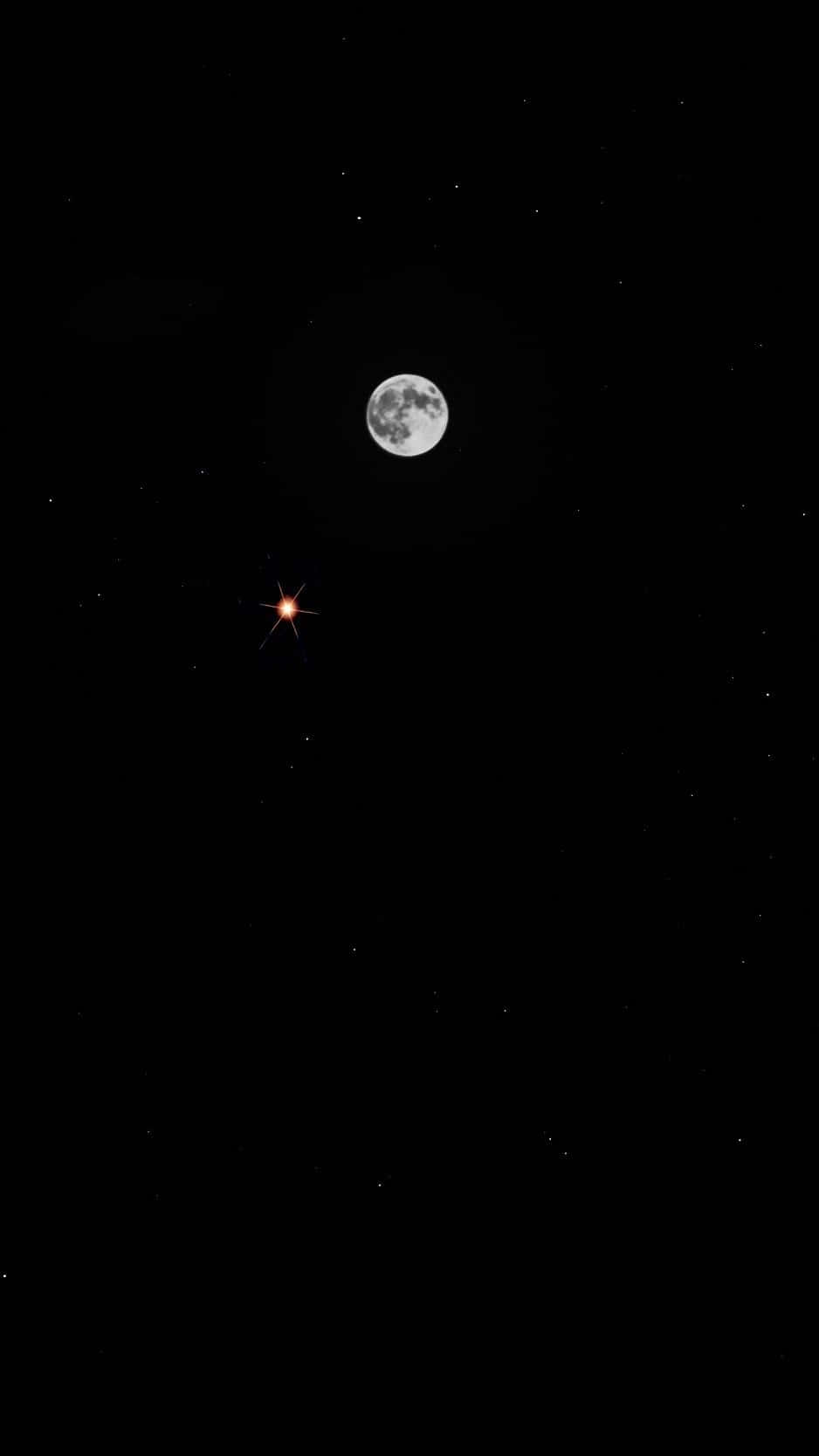 Dive Into A Star-studded Evening With Moon Iphone Wallpaper