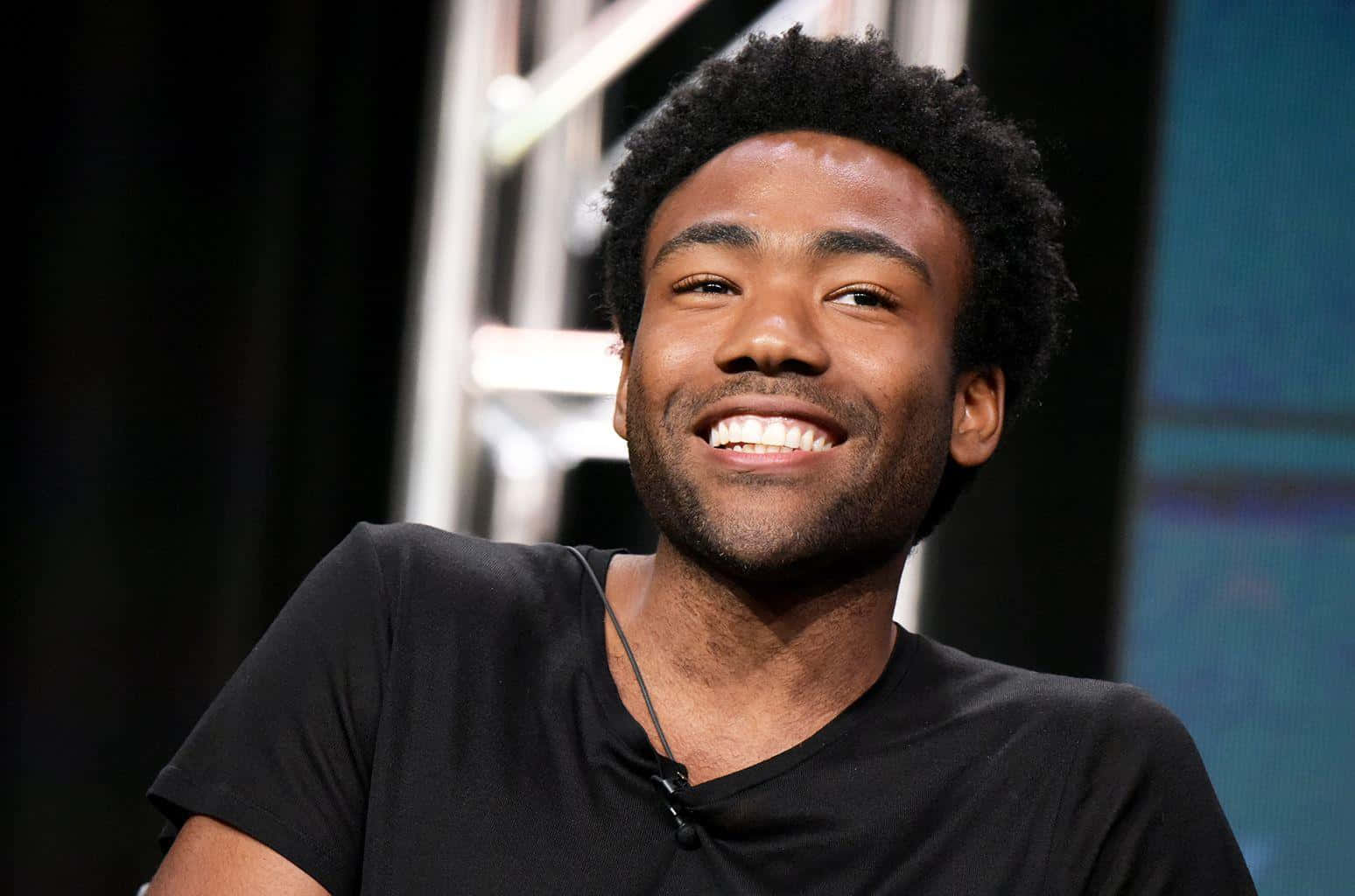 Donald Glover Smiling During Interview Wallpaper