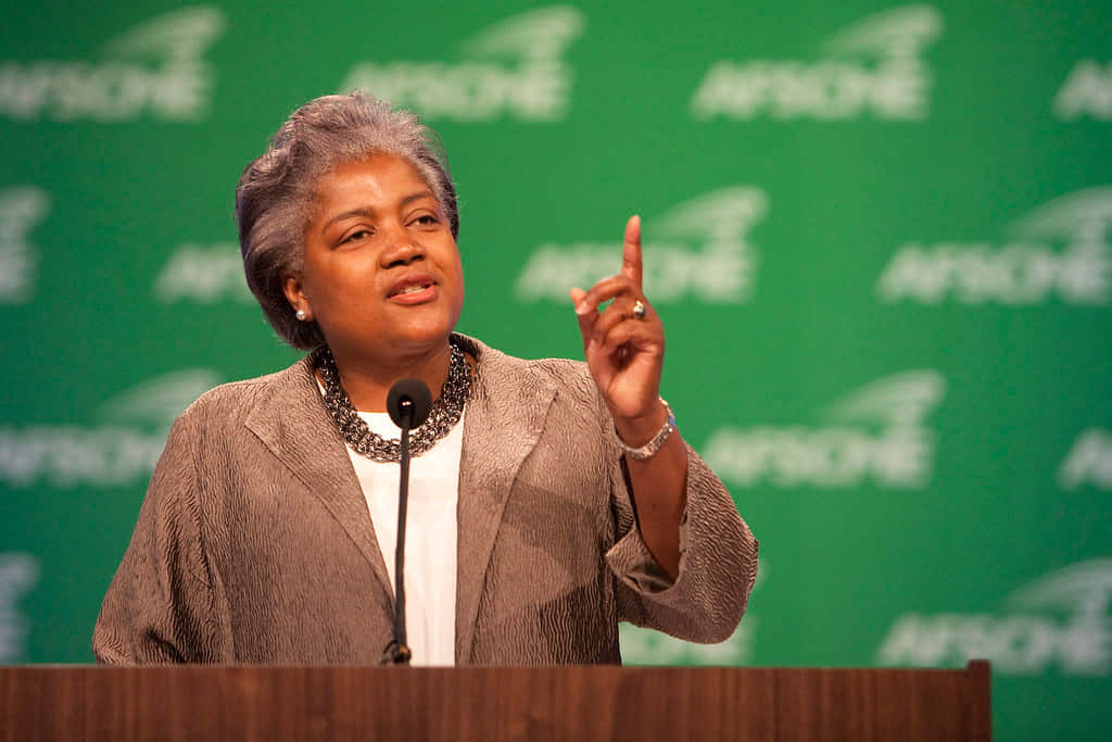 Donna Brazile Posing Confidently In A Studio Wallpaper