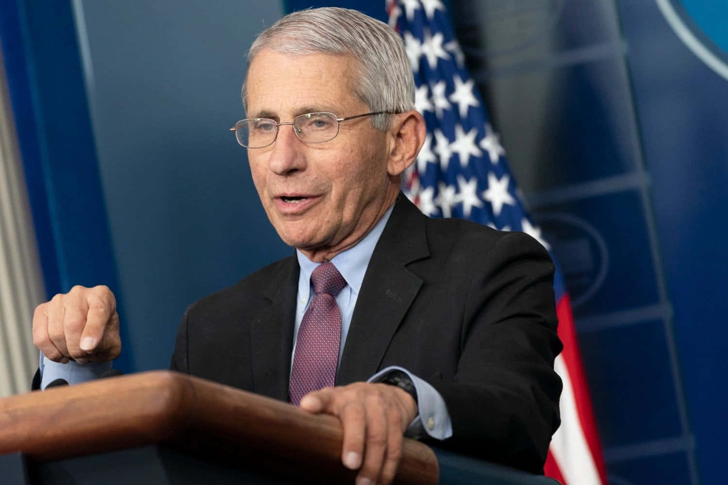 Dr. Anthony Fauci Delivering A Lecture On Public Health Wallpaper