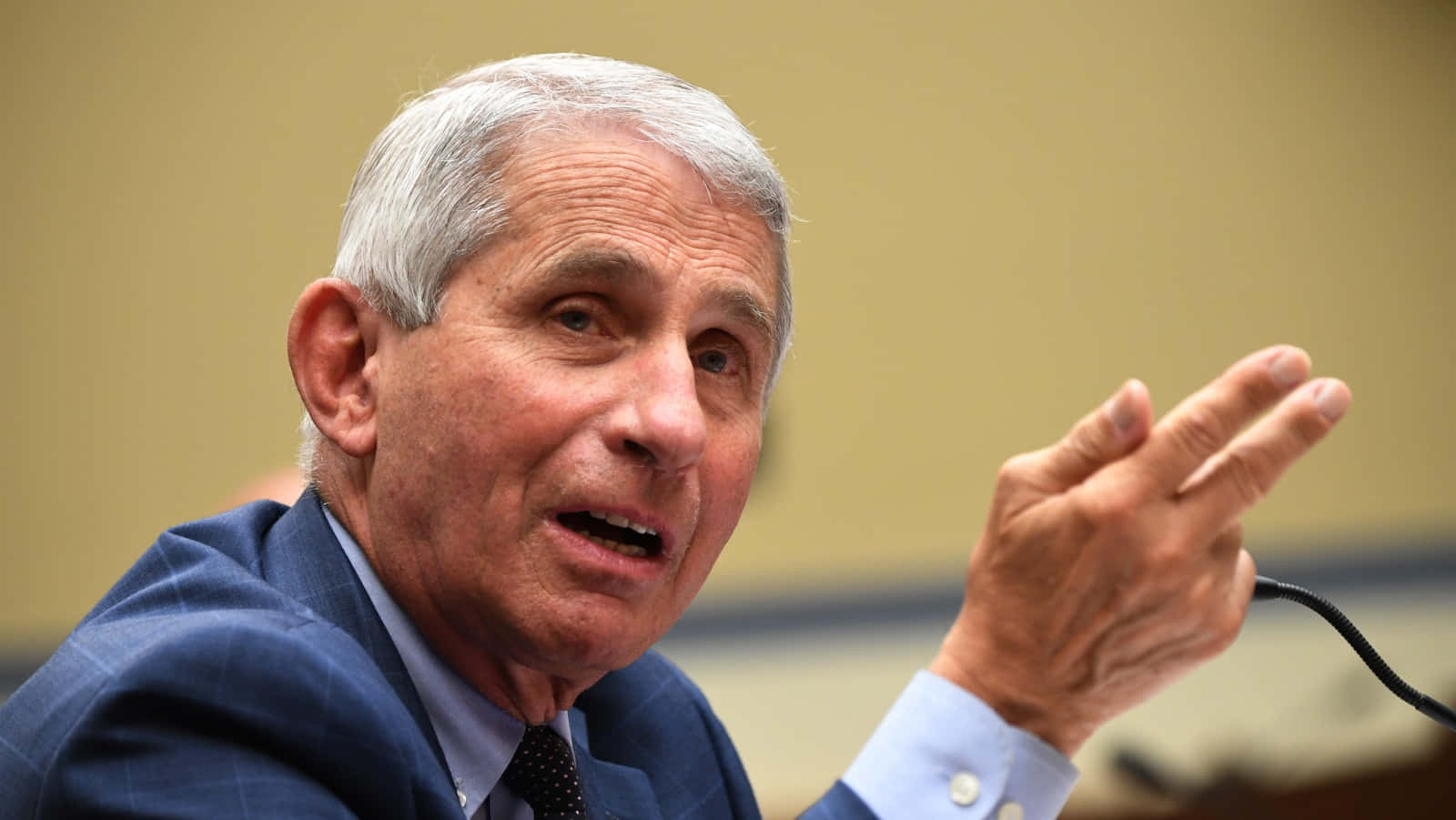 Dr. Anthony Fauci Delivering A Speech Wallpaper