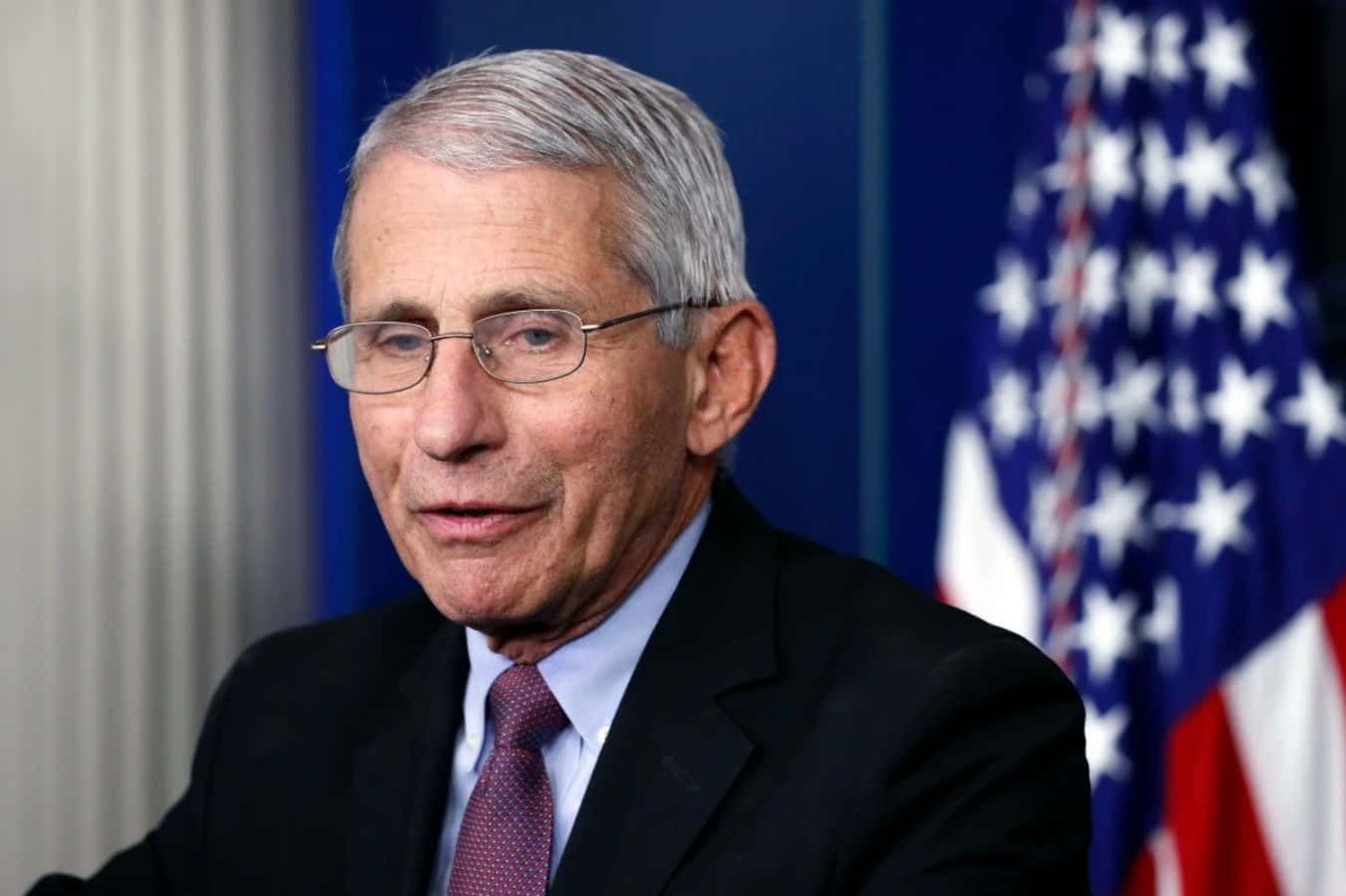 Dr. Anthony Fauci During A Health Conference Wallpaper