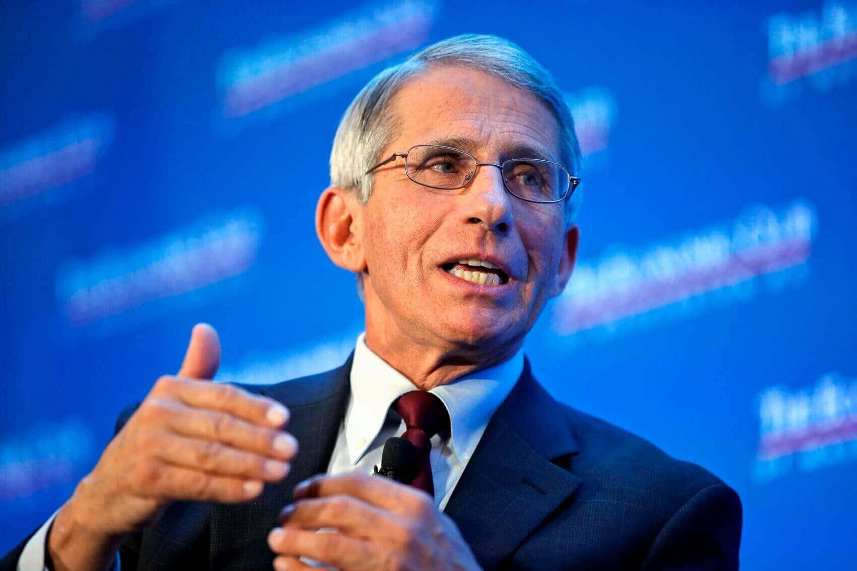 Dr. Anthony Fauci In A Press Conference Wallpaper