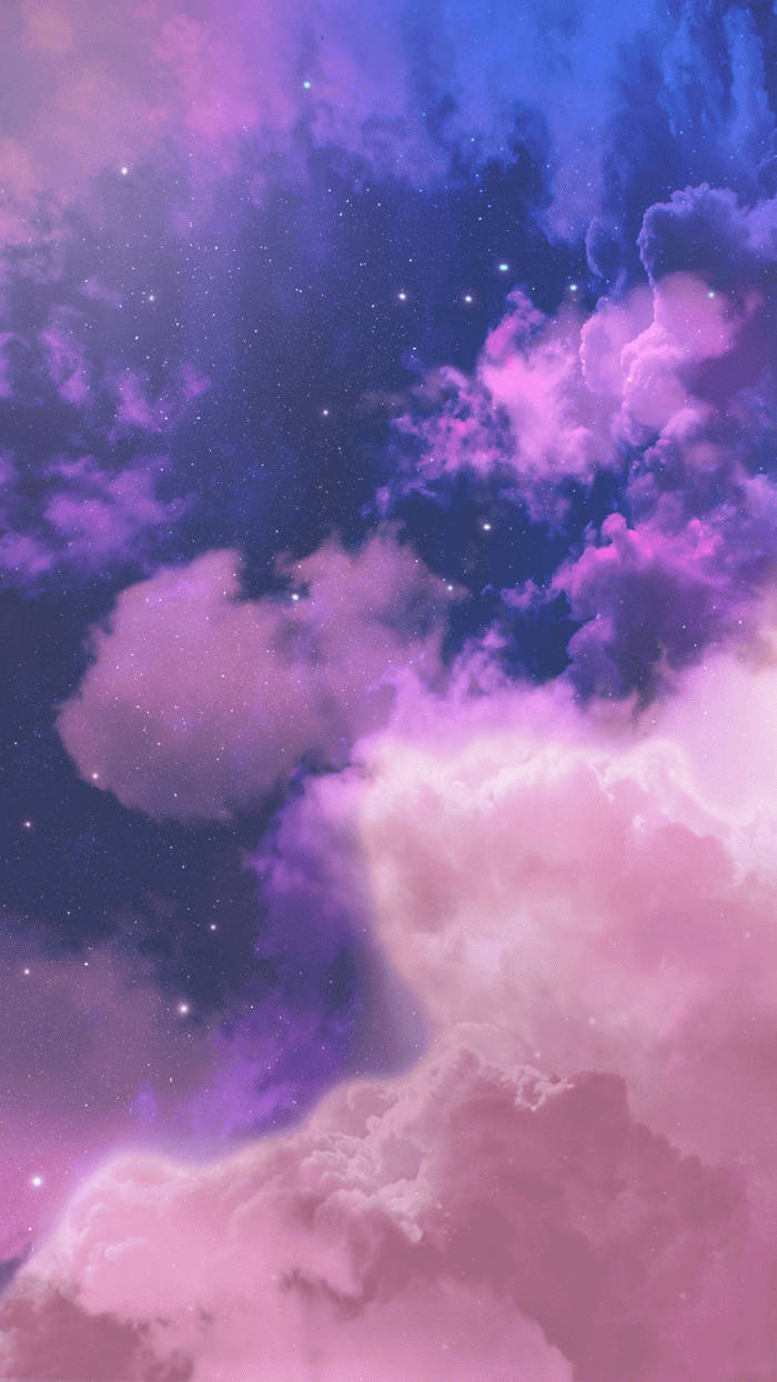 Dreamy Purple Clouds Illuminated By The Golden Sunset Wallpaper