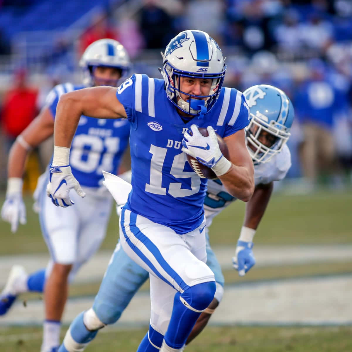 Duke Football Player Running With Ball Wallpaper