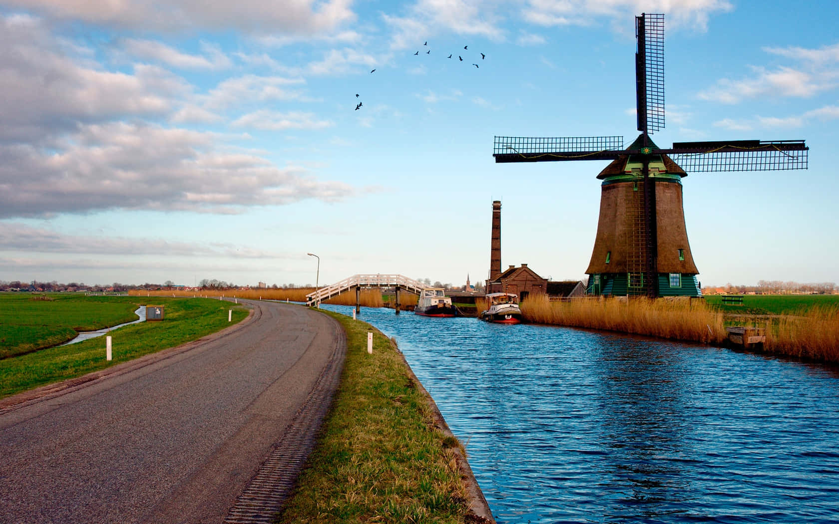 Dutch Windmill Beside Waterway Wallpaper