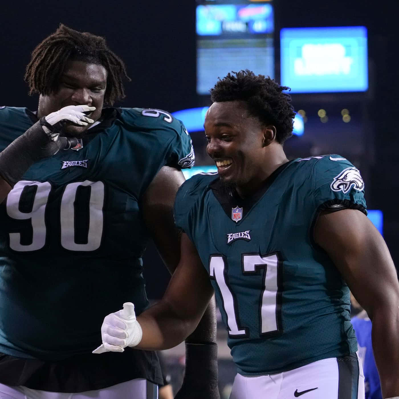 Eagles Players Celebrating On Field Wallpaper