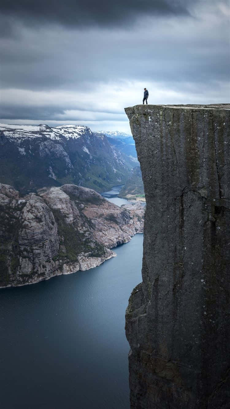 Edge_of_ Cliff_ Overlooking_ Fjord Wallpaper