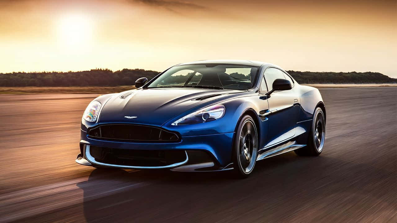 Elegant Aston Martin Vanquish In Motion Wallpaper