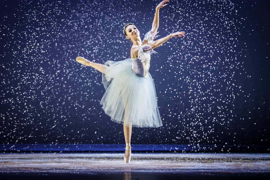 Elegant_ Ballet_ Dancer_ Snowflake_ Performance.jpg Wallpaper