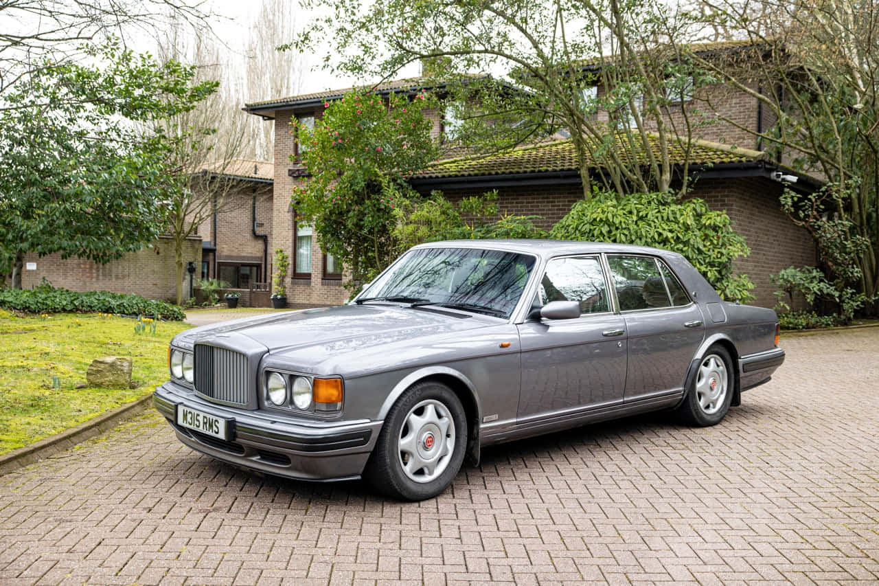 Elegant Bentley Turbo R At The Showroom Wallpaper