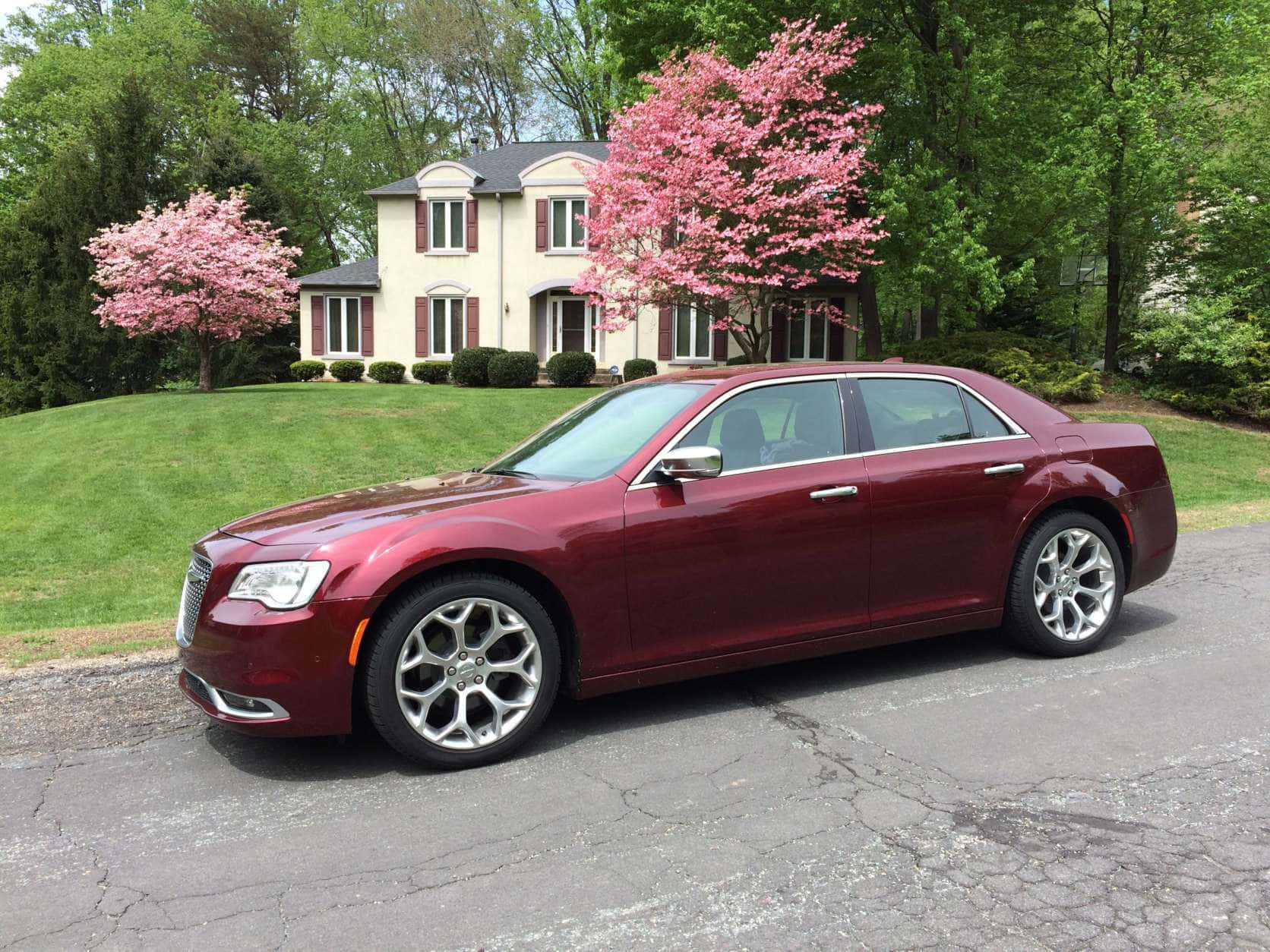 Elegant Chrysler 300 Gliding On Asphalt Wallpaper