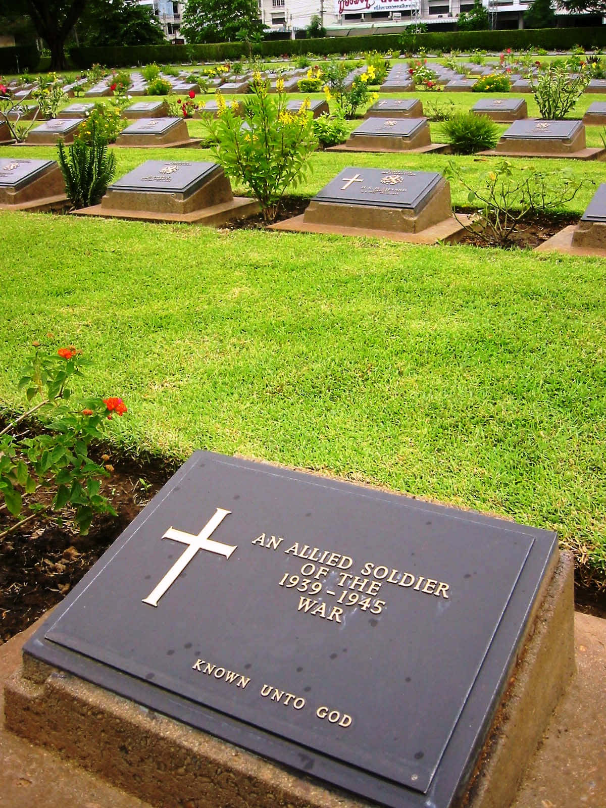 Elegant Gravestone With Beautiful Flower Decoration Wallpaper