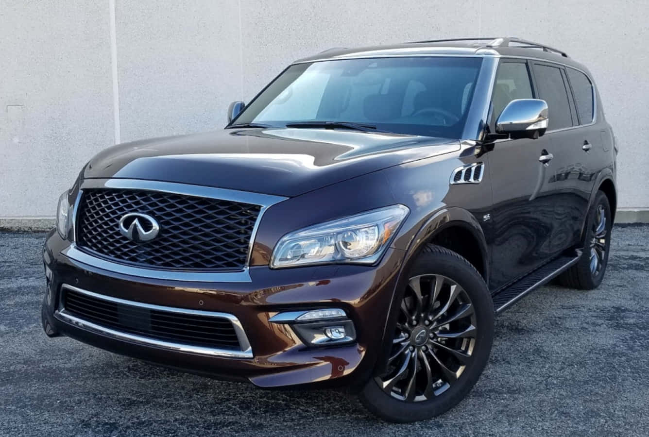 Elegant Infiniti Qx80 In Scenic Landscape Wallpaper