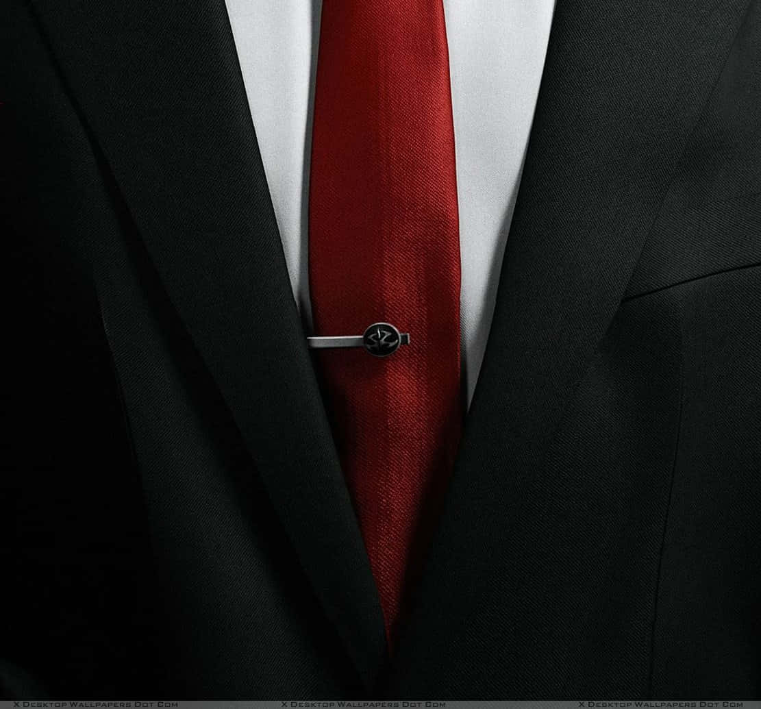 Elegant Man Wearing Luxurious Red Tie Wallpaper