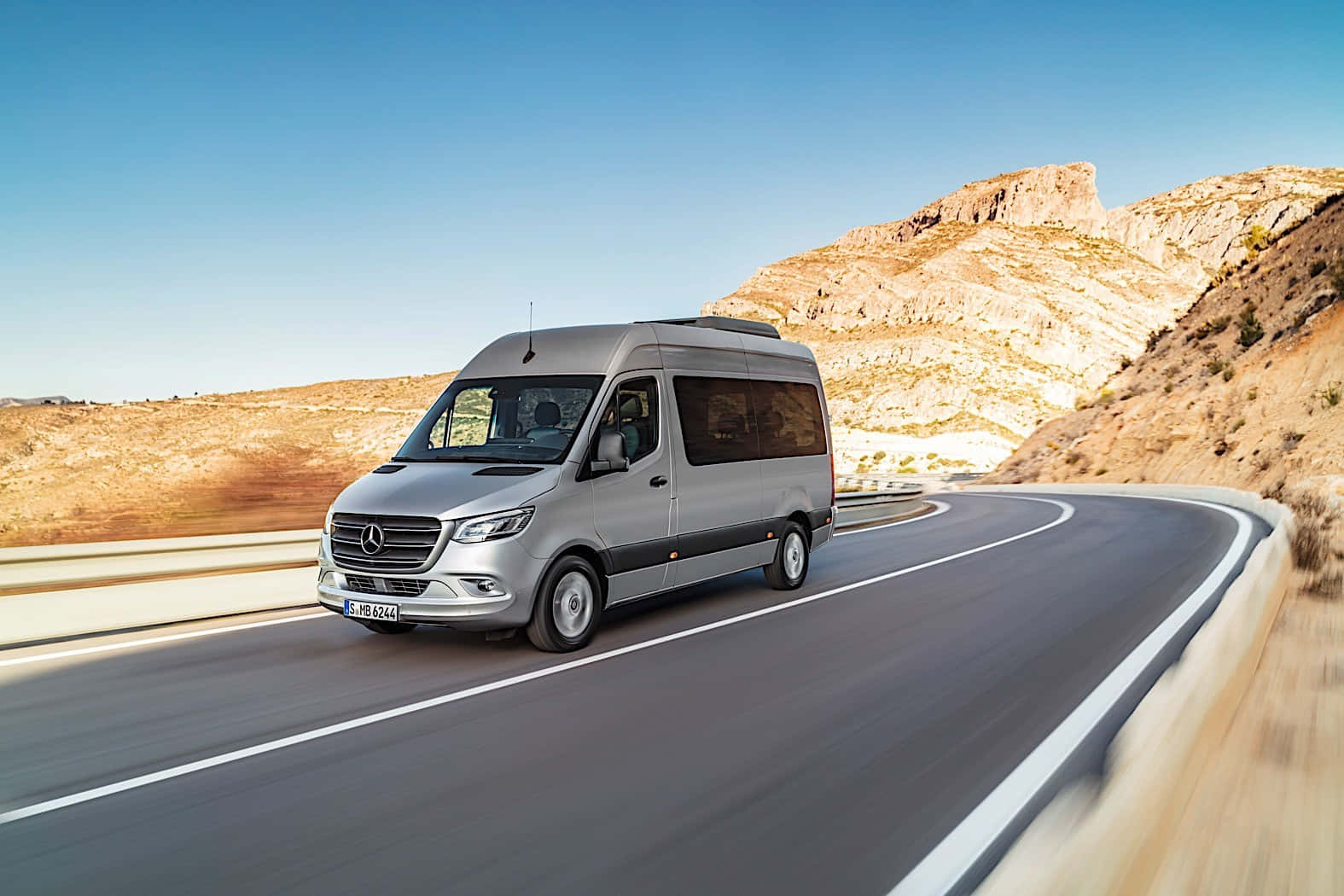 Elegant Mercedes Benz Sprinter On The Road Wallpaper