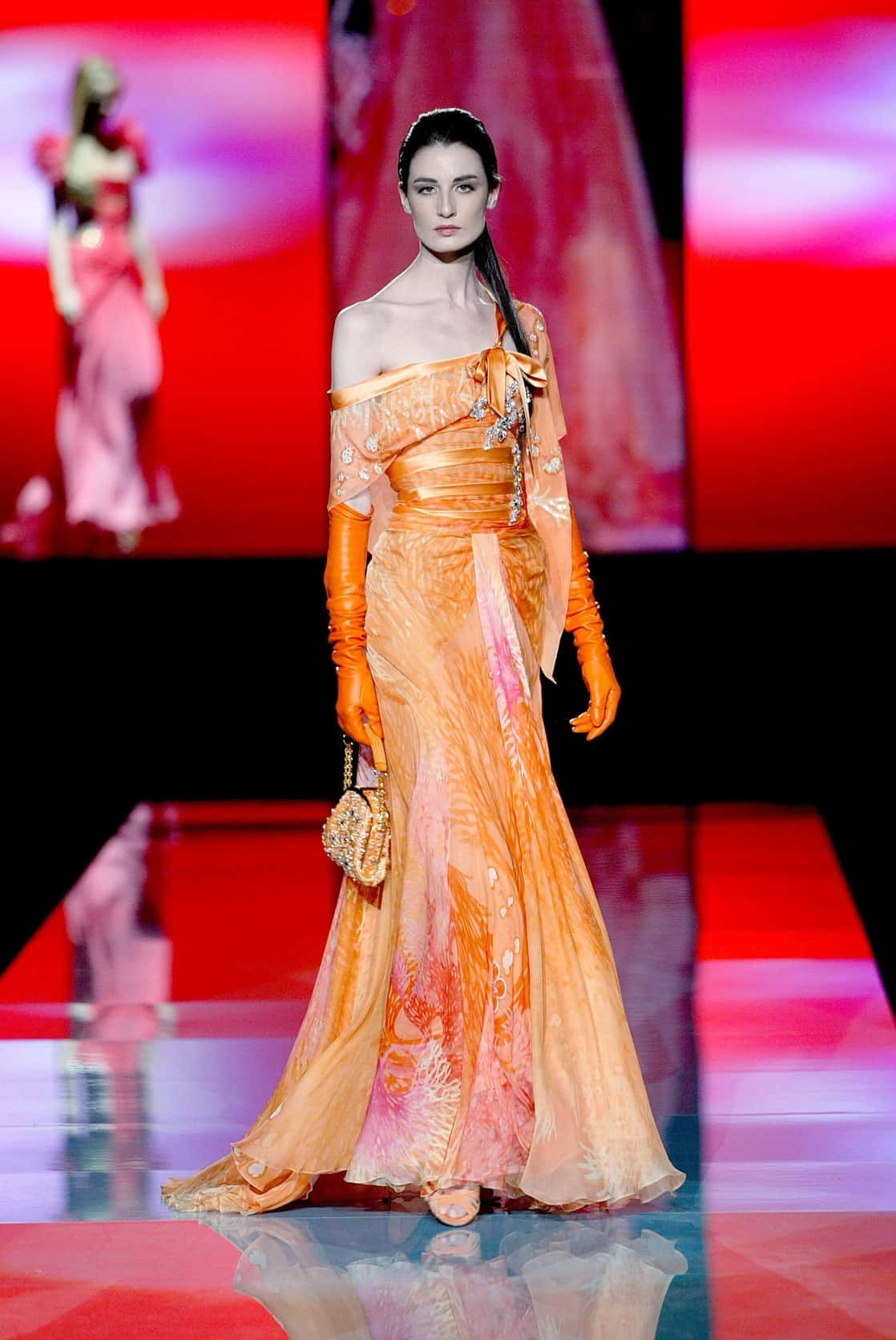 Elegant Orange Gown Fashion Runway Wallpaper