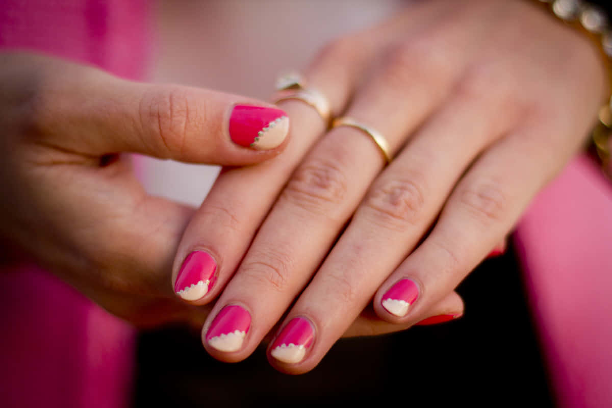 Elegant Pink Nails On A Beautiful Hand Wallpaper