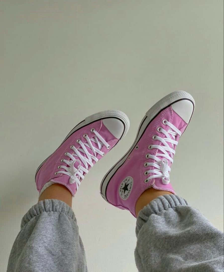 Elegant Pink Shoes On A Gray Surface Wallpaper