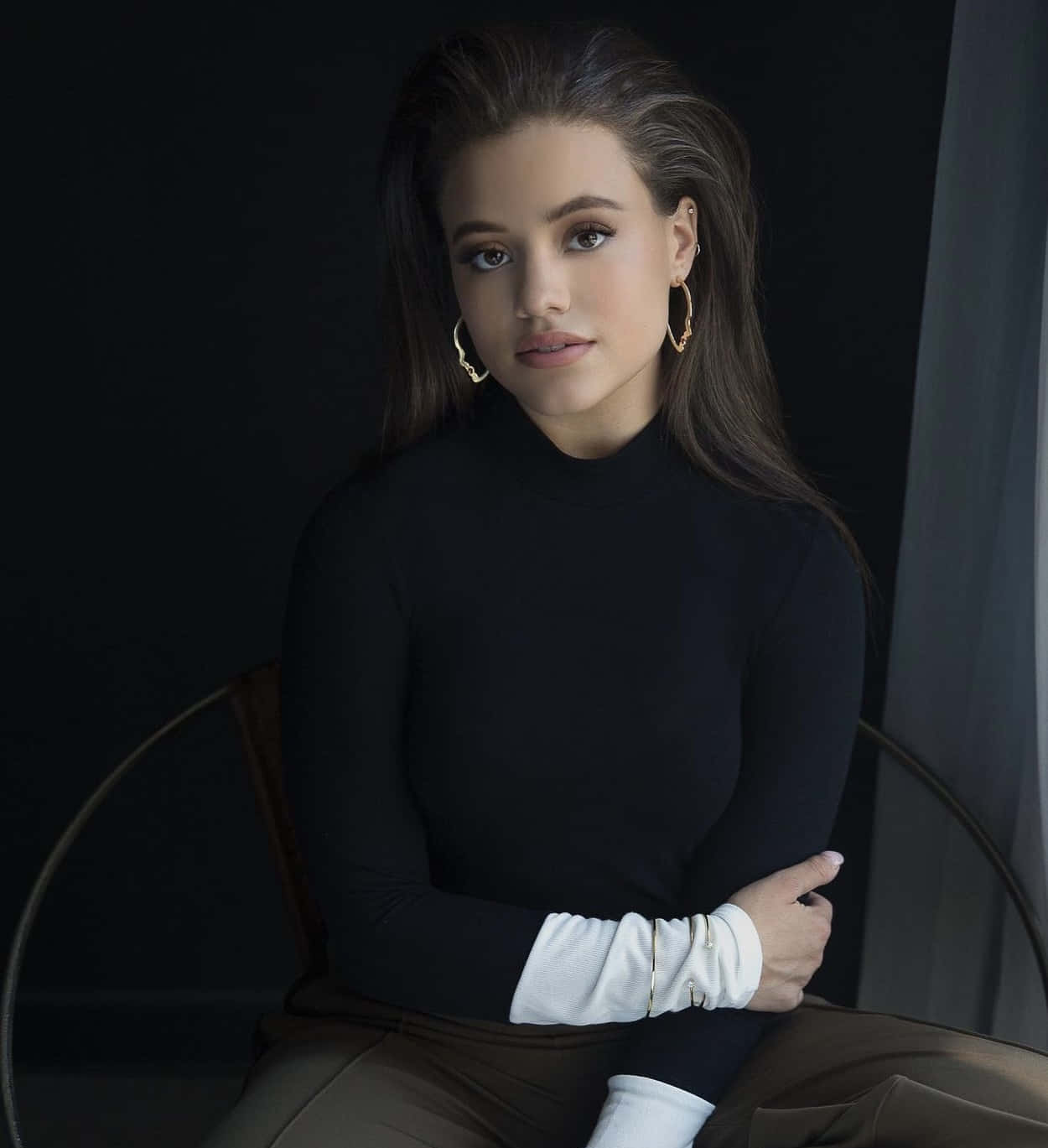 Elegant Portraitof Womanin Black Turtleneck Wallpaper