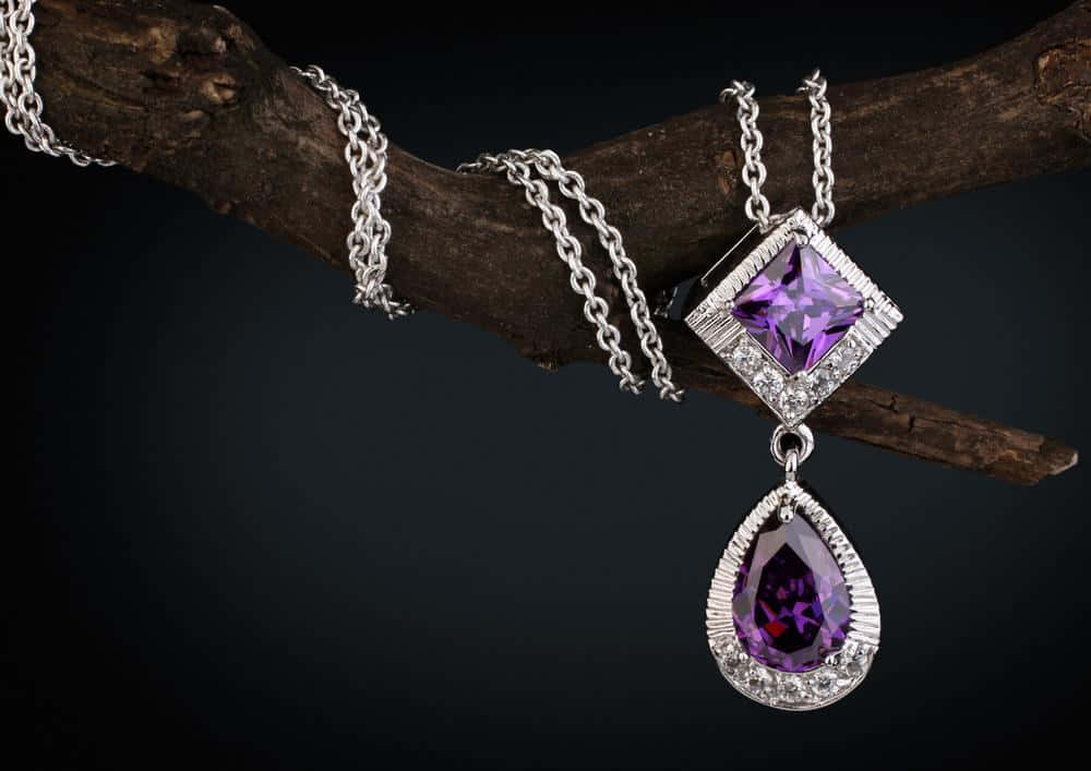 Elegant Purple Gemstone Pendant Jewelry Wallpaper