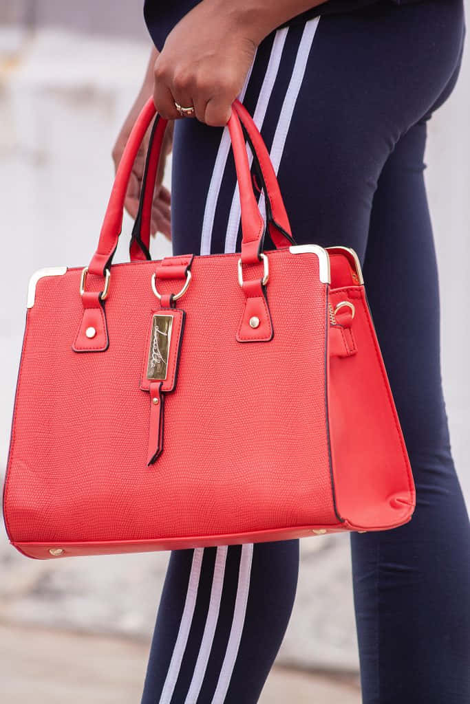 Elegant Red Handbag For Stylish Women Wallpaper