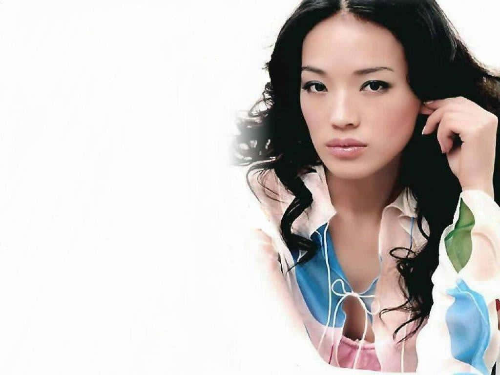 Elegant Shu Qi Posing For A Photoshoot Wallpaper