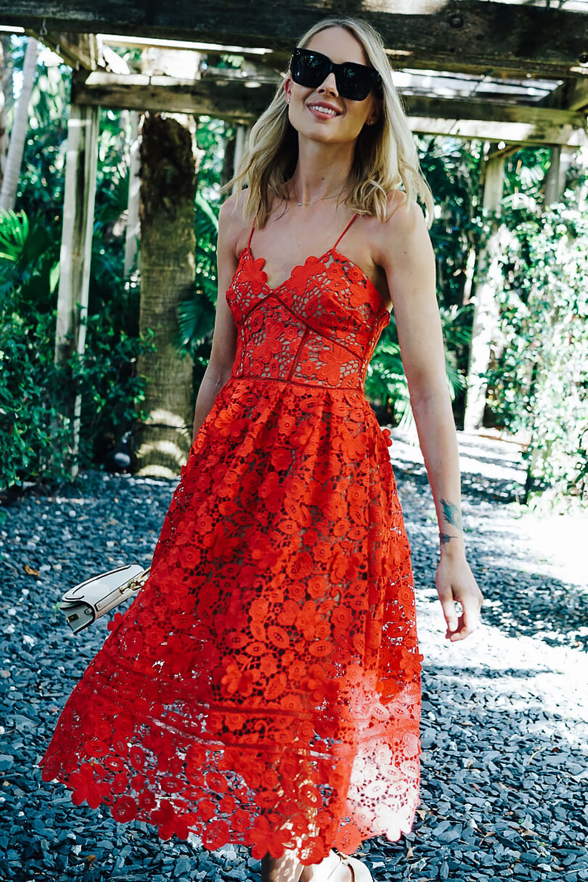 Elegant Woman In A Stunning Red Lace Dress Wallpaper