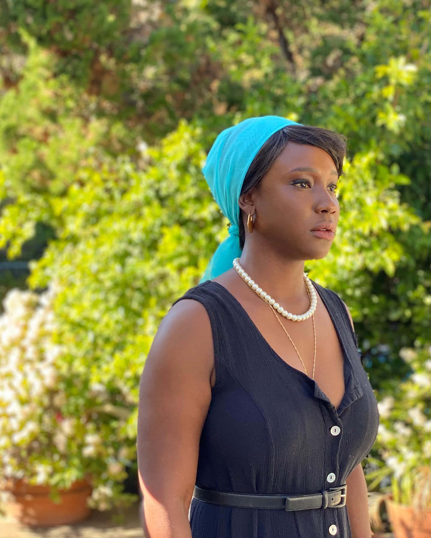 Elegant Womanin Blue Headwrap Wallpaper