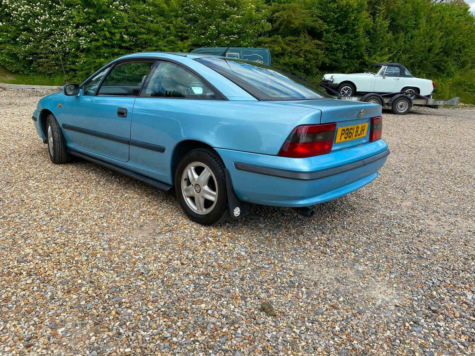 Elegantly Designed Opel Calibra Captured In Motion Wallpaper