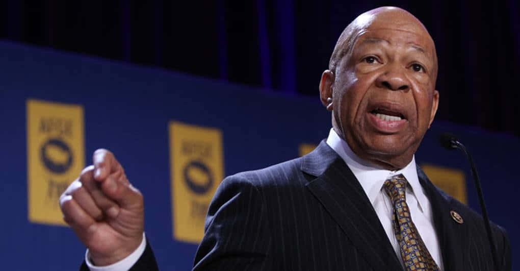 Elijah Cummings Speaking In Front Of Blue Backdrop Wallpaper