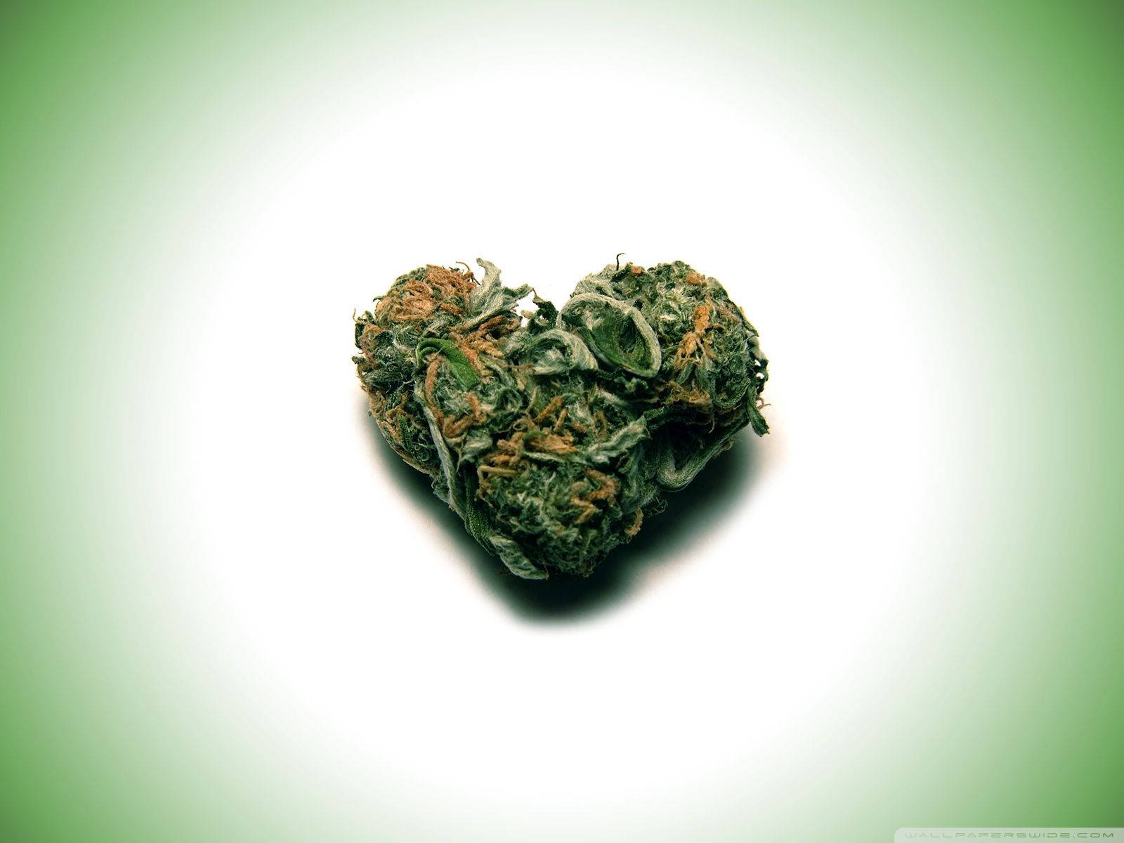 Embrace Love And Luck With This Little Green Weed Heart Wallpaper