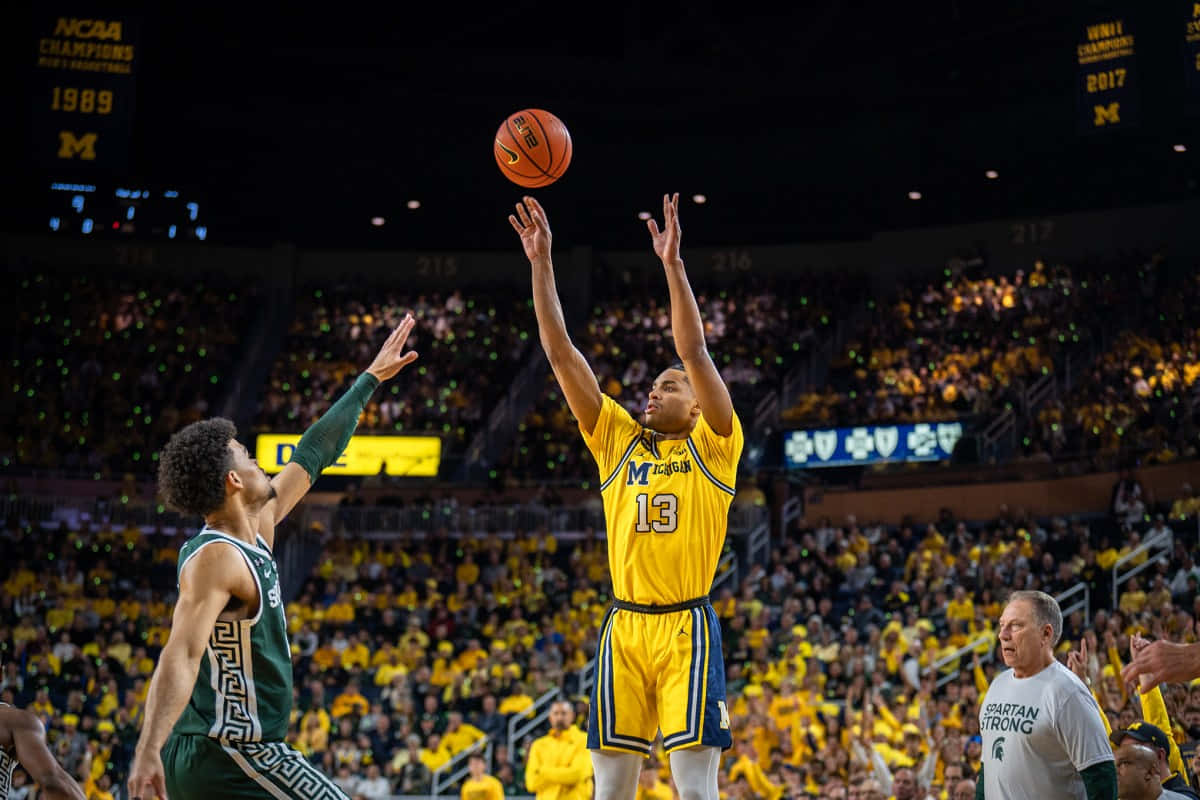 Emerging Basketball Star Jett Howard In Action On The Court. Wallpaper