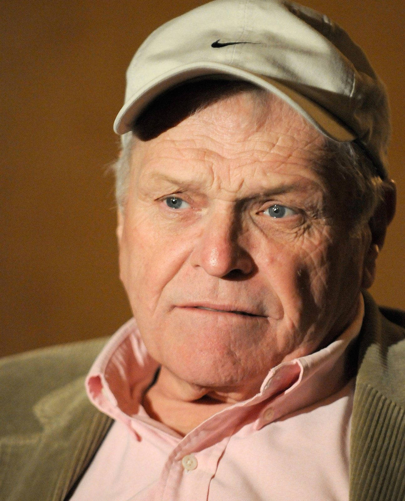 Eminent Actor Brian Dennehy Posing With A Brown Cap Wallpaper