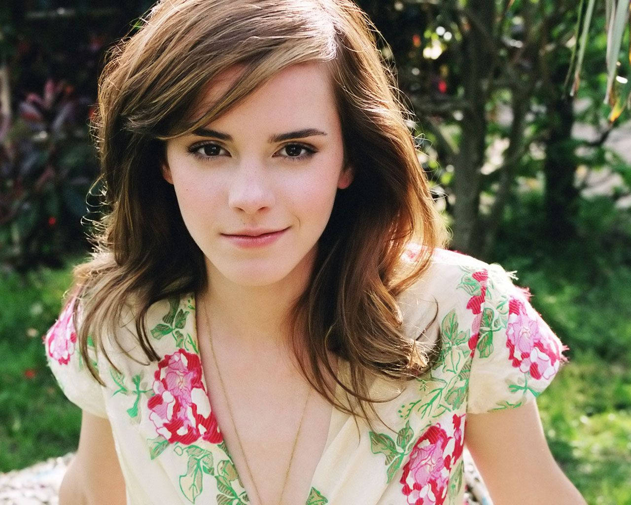 Emma Watson Channeling A Modern-day Princess In A Beautiful Floral Dress Wallpaper