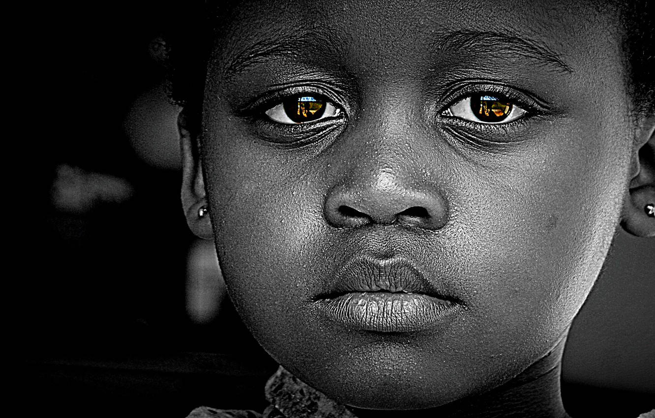 Emotive Portrait Of A Black Girl With Sad Eyes Wallpaper