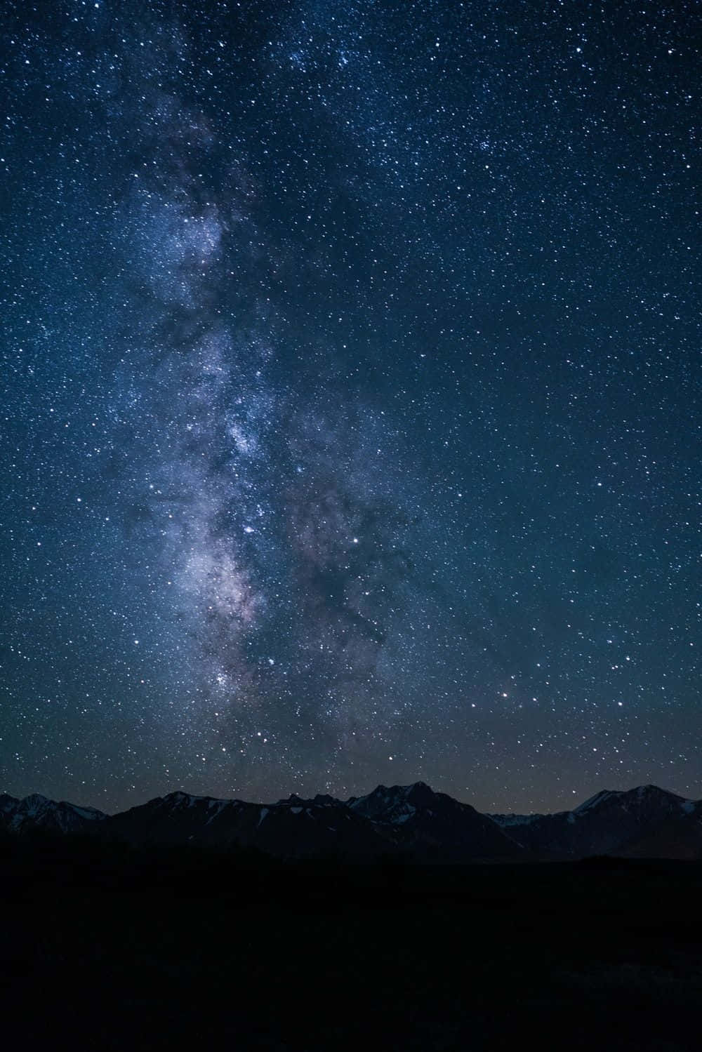 Enchanting Dark Sky Illuminated By Stars Wallpaper