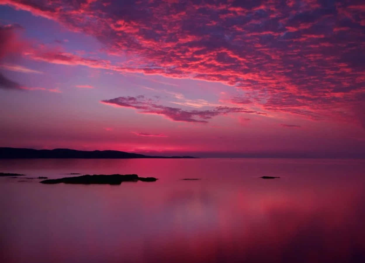 Enchanting Pink Sky At Dusk Wallpaper