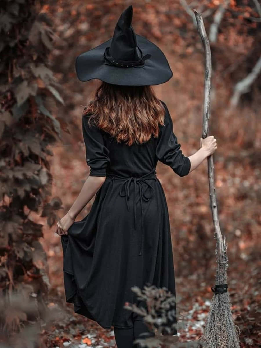 Enchanting Witch Costume For Halloween Wallpaper