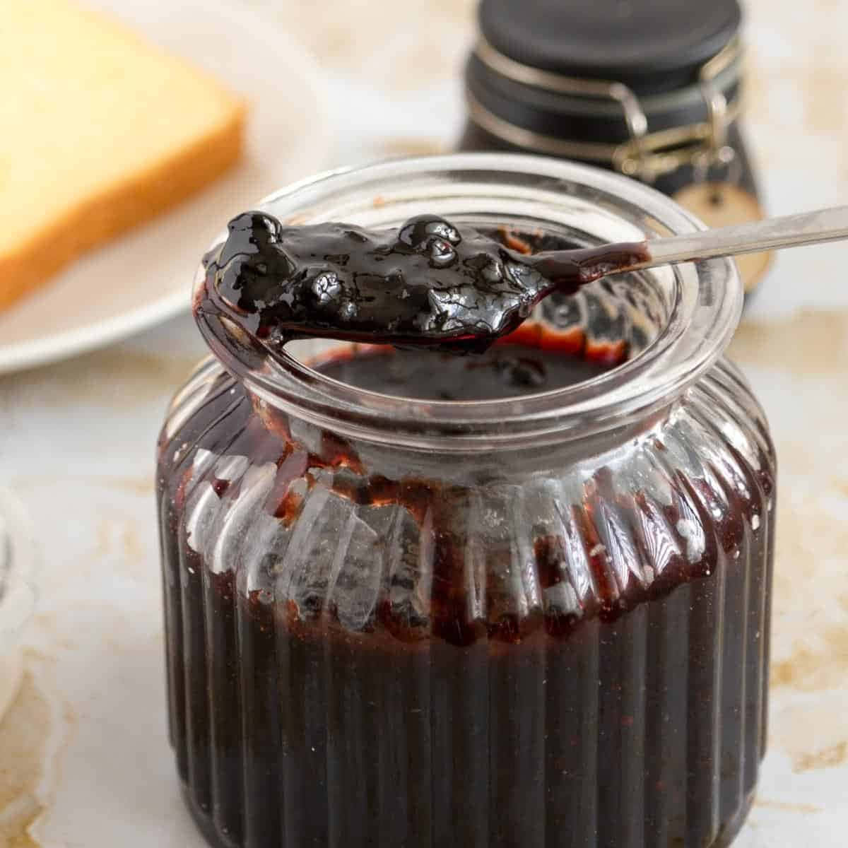 Enjoy A Jug Of Delicious Blueberry Jam Wallpaper