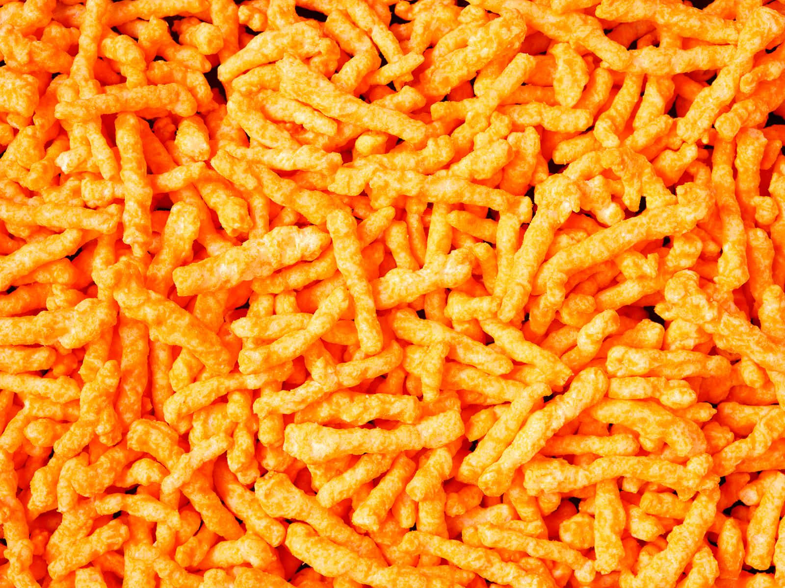 Enjoy Cheetos For A Spicy Snack In A Variety Of Flavors! Wallpaper