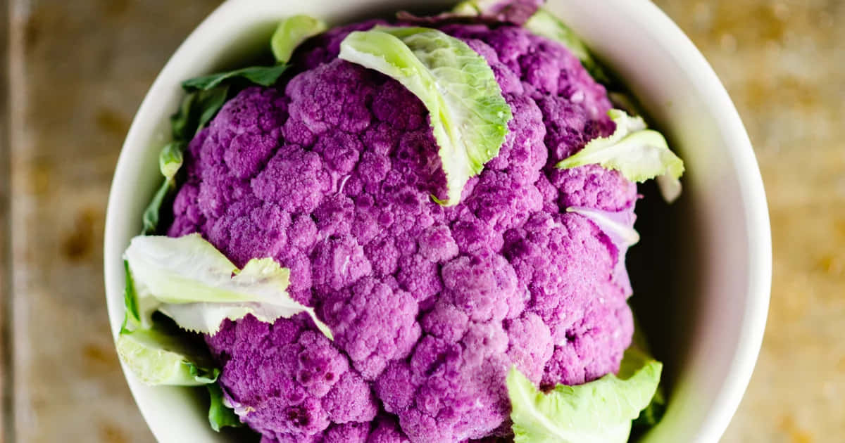 Enjoy The Beautiful Colors Of Nature With Purple Cauliflower Wallpaper